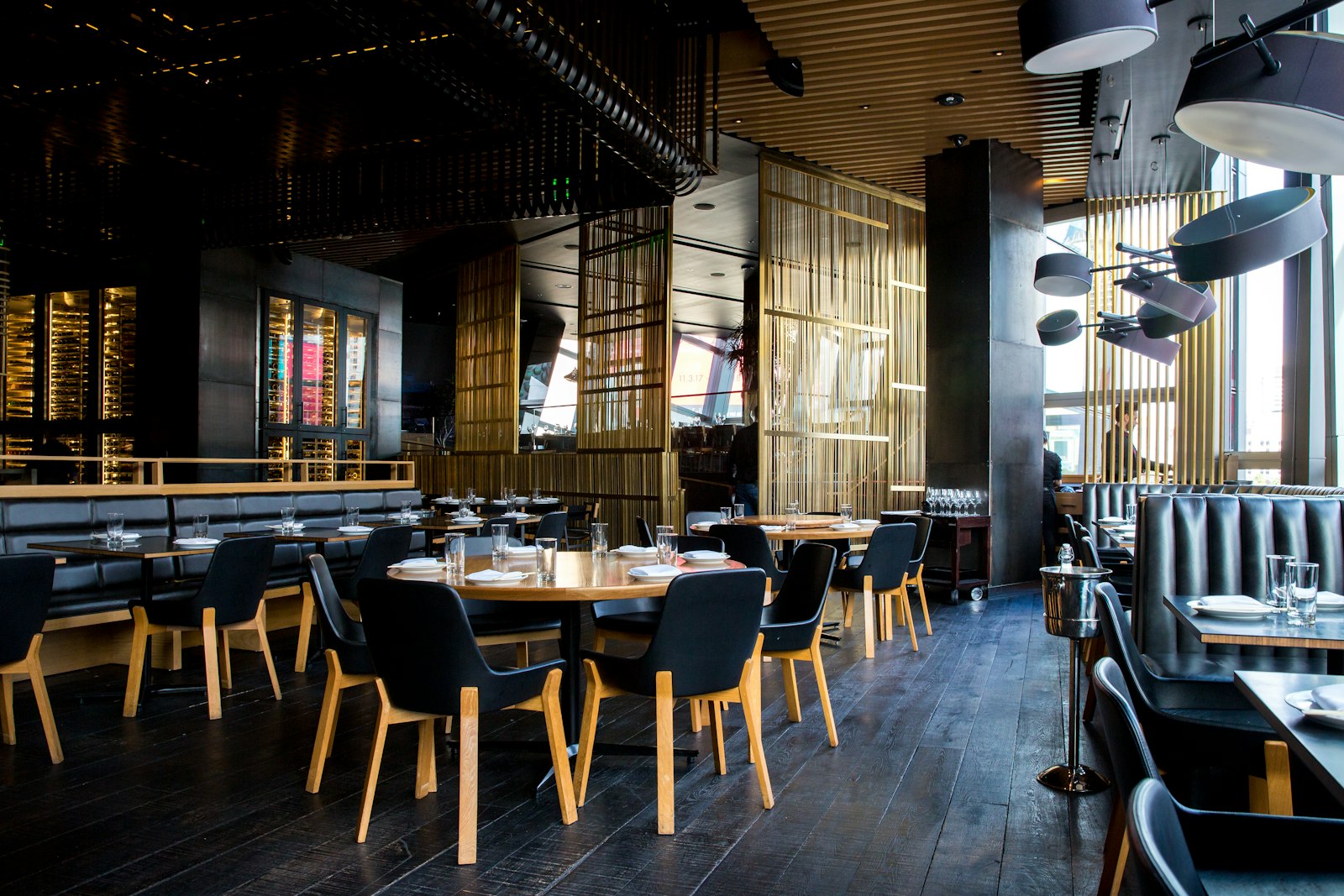 Fine-dining wine glasses and warm restaurant setting