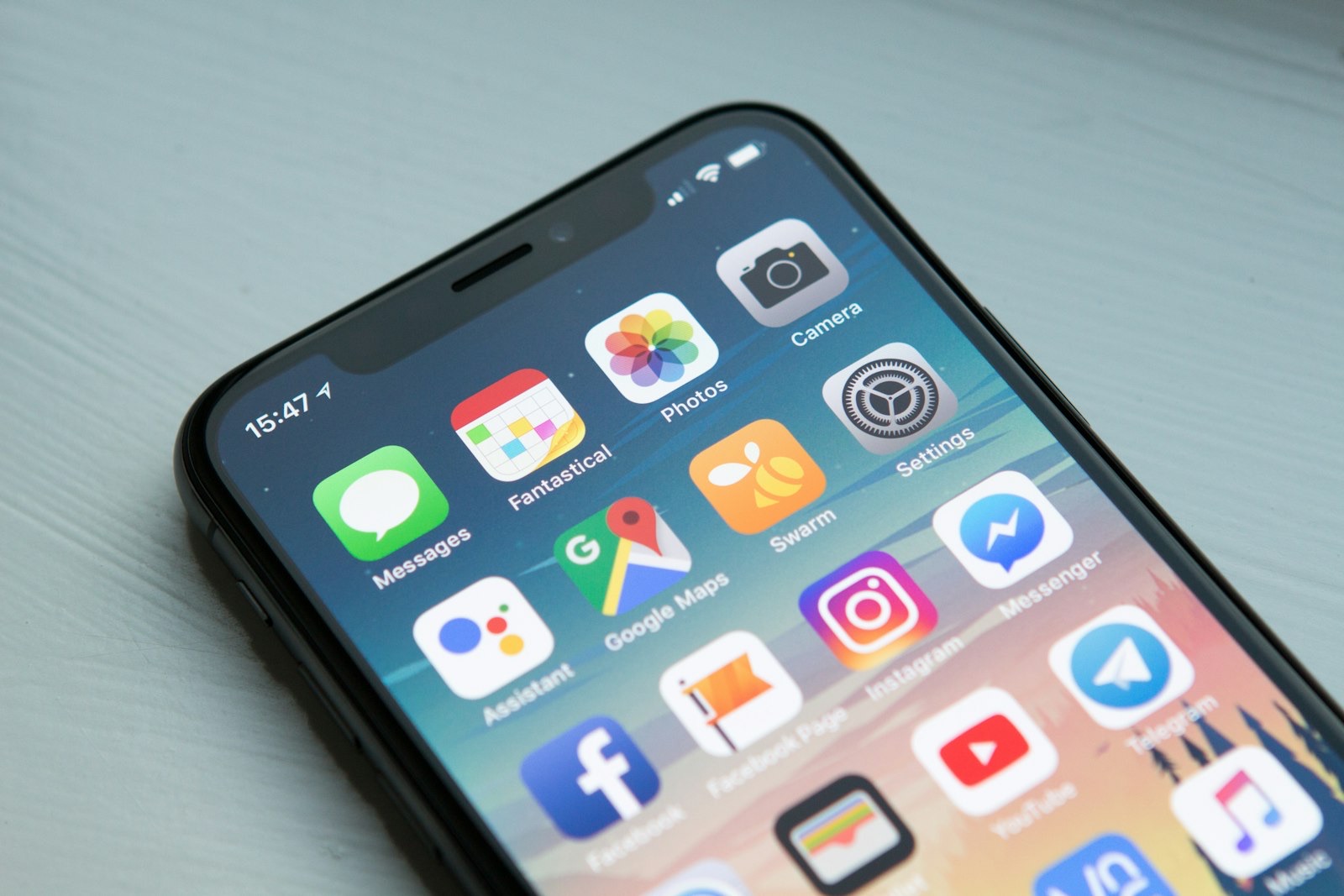 A smartphone home screen full of apps