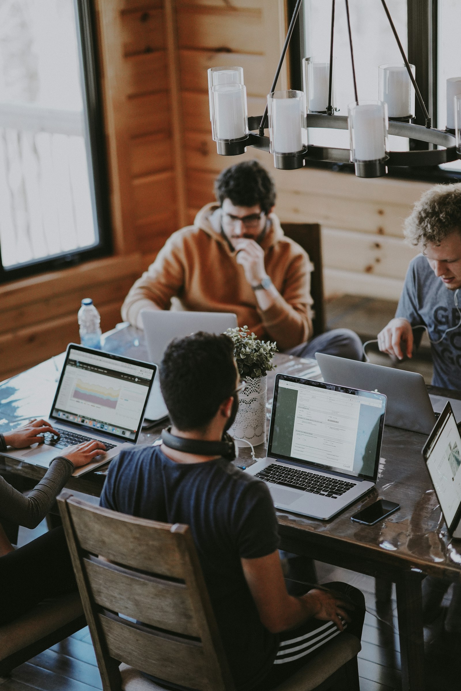 Modern enterprise office — diverse team at a collaborative meeting table