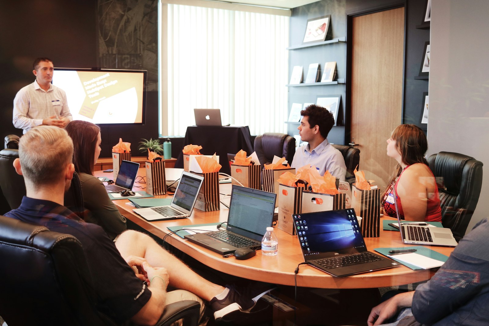 Analytics dashboard on a laptop screen — team reviewing data together