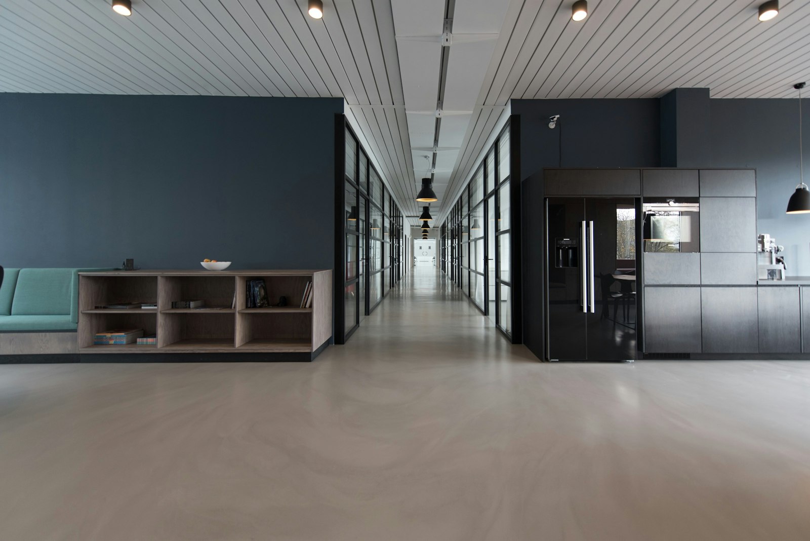 Modern editorial workplace — light-flooded open-plan office