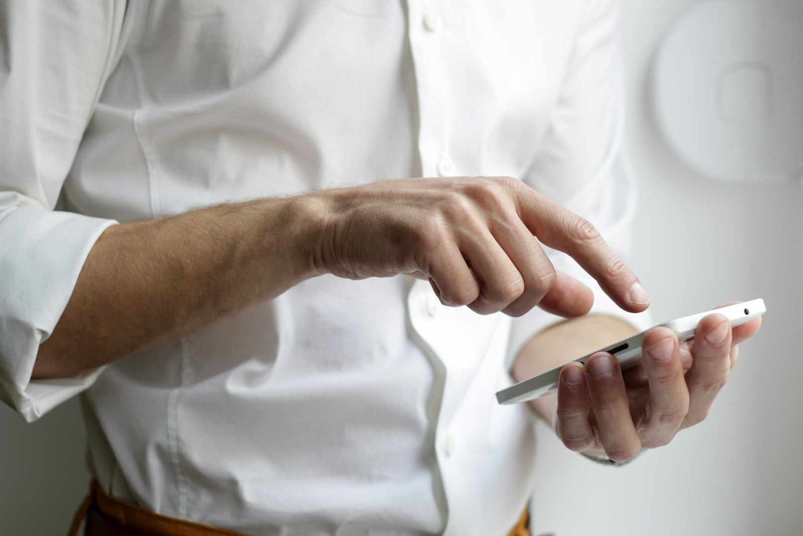 Person holding phone — calm interior context